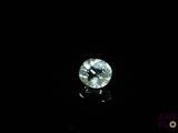 a close up of a diamond on a black surface