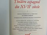 an open book with red writing on it sitting on a table