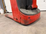 a close up of a fork lift truck in a garage
