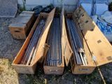 many different types of rods in a box on the ground