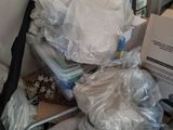 a pile of luggage sitting on top of a chair in a room