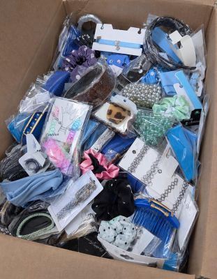 a cardboard box filled with assorted items for sale