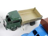 a toy truck that is next to a toy truck