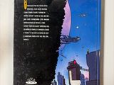 the back cover of a book with a picture of a spaceship flying over a city