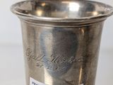 a silver cup that has a label on it