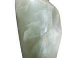 marble sculpture of a hand on a wooden base