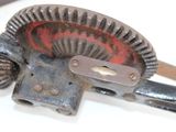 a close up of a metal object on a white surface