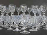 a lot of wine glasses that are sitting on a table