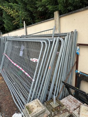 a fence that has a bunch of metal bars on it