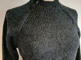 the top of a sweater with a zippered neckline is shown on a mannequin mannequin mannequin mannequin mannequin manne