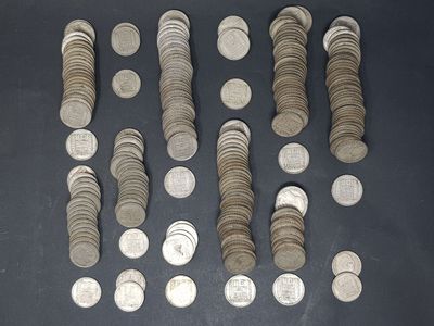 a lot of coins that are on the table