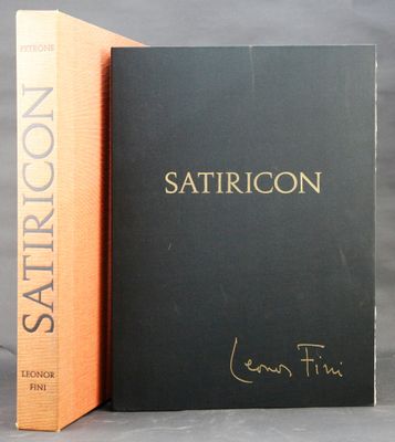 two books sitting next to each other on a gray surface
