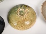 three different types of bowls on a white table