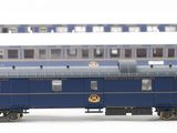 a blue train car that is sitting on the tracks