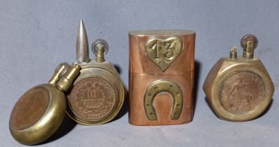 four different types of brass objects are displayed on a blue surface