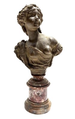 bronze bust of a woman on a marble pedestal on a white background