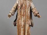 an old statue of a man with a hood on his head