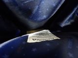 a close up of a label on a blue jacket