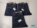 three pairs of men ' s jeans with tags on them