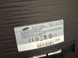the back end of a laptop computer with a hard drive attached to it