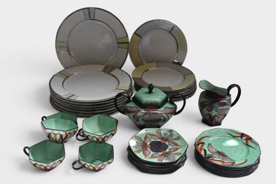 many plates, cups, and bowls that are sitting on a table