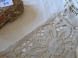 a lot of laces on a table with a price tag on it