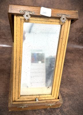 an old wooden frame with a mirror on top of it