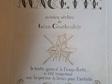 an old book with writing on it sitting on a table