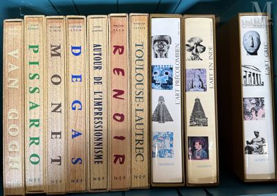 several books are stacked on top of each other on a shelf
