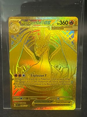 a close up of a pokemon card in a plastic case