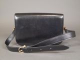 black leather cross body bag with gold hardware and strap