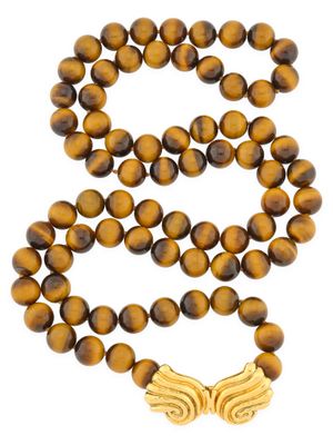 a tiger ' s eye bead necklace with a gold butterfly charm