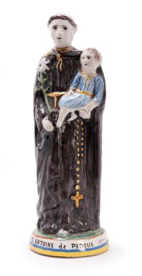 figurine of a saint holding a child in his arms
