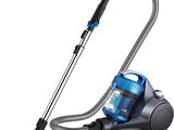 a blue vacuum cleaner with a black handle on a white background