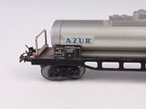 a toy train car with a tank on the side of it