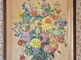 painting of a bouquet of flowers in a vase hanging on a wall