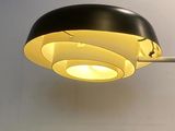 a black and white lamp that is on the wall