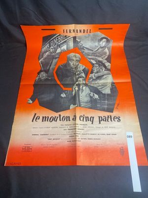 an orange and black poster with a picture of a man on a motorcycle