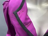 purple jacket with black trim and buttons on a mannequin mannequin mannequin mannequin mannequin mannequin mannequin manne