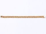 a close up of a gold chain bracelet on a white background