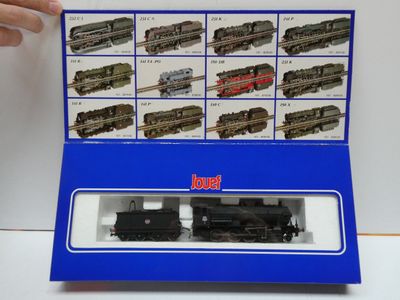 a box with a train set in it on a table
