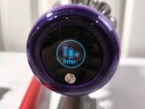 a close up of a purple device on a table