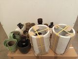 many different vases sitting on top of a cardboard box