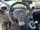 the interior of a car with a steering wheel and dashboard controls