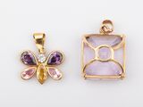 two gold and amethorate pendants, one with an amethorate and one with an amethorate and amethorate
