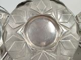 pair of silver plated candlestick holders with starburst design