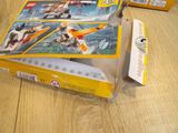 a box of legos sitting on a wooden table