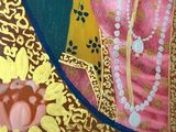 a painting of a woman in a pink dress and pearls