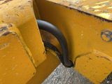 a close up of a piece of machinery that is yellow