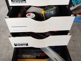 a stack of drawers with tools in it on the floor